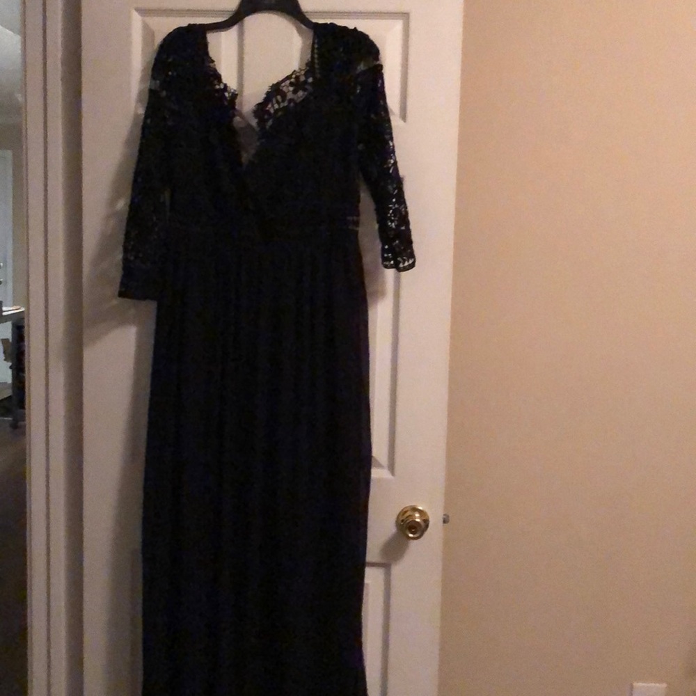 Black formal dress with lace up top and shear across the breast area